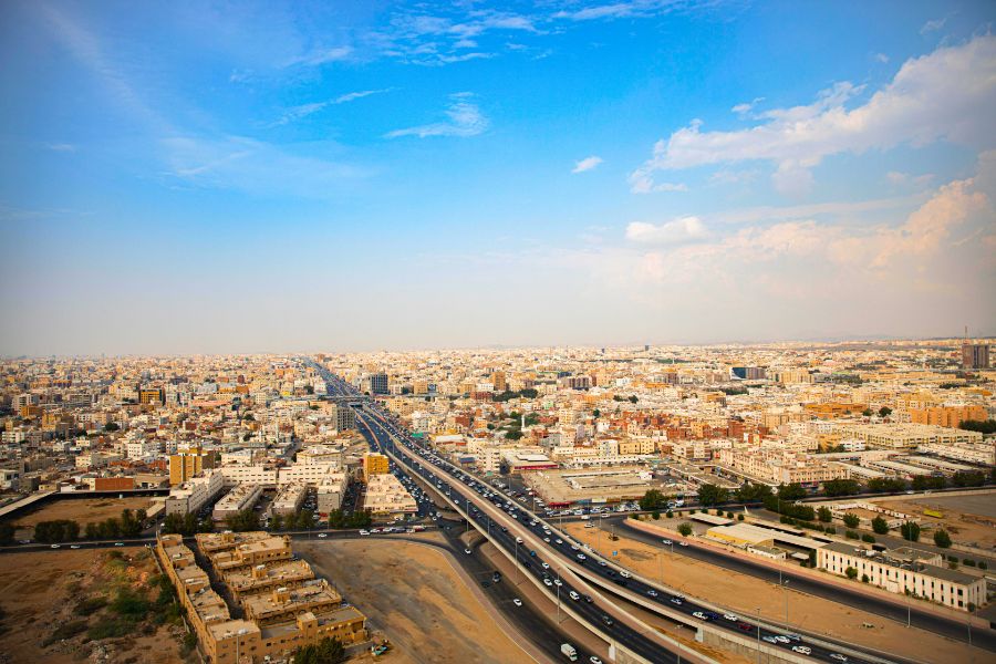 Woman with Rental Car at the Airport